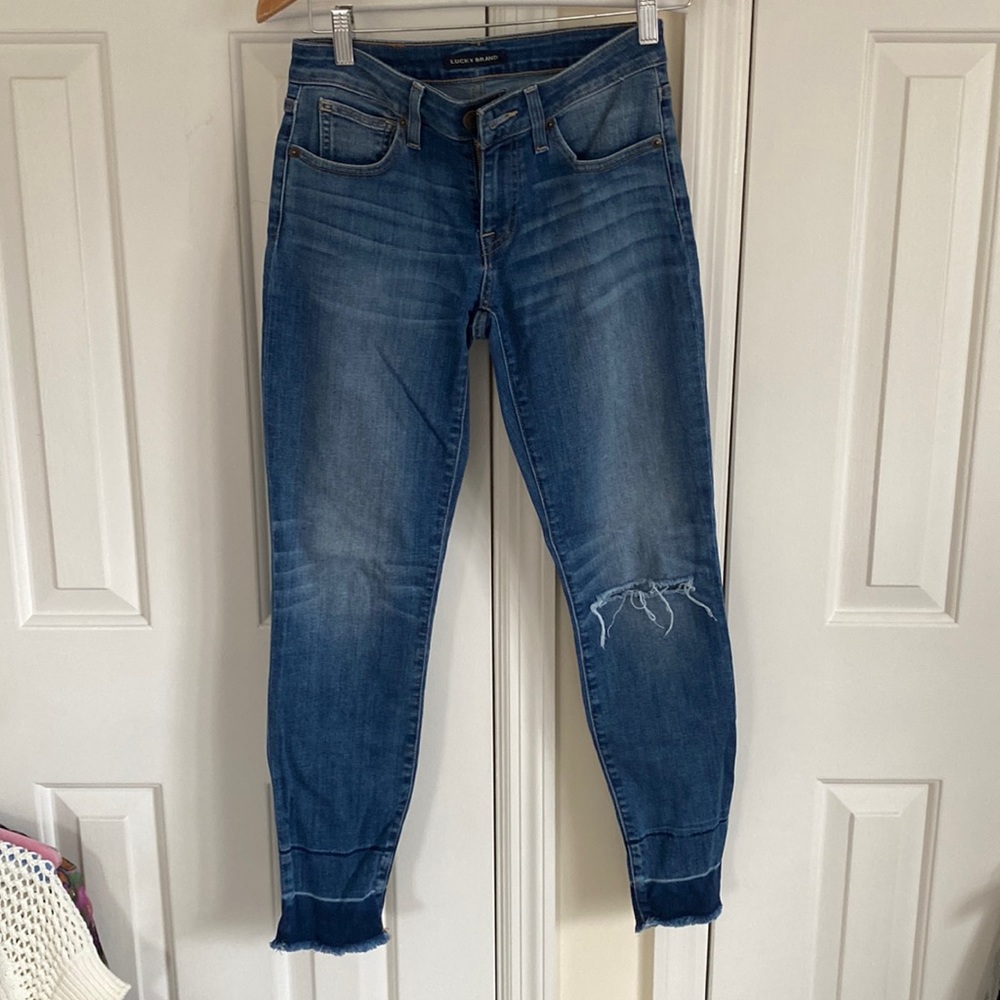 Lucky brand size 25 skinny jeans - with a frayed and darker bottom
